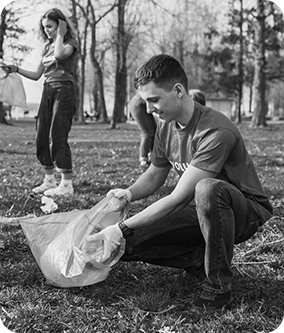 people collecting trash from the park